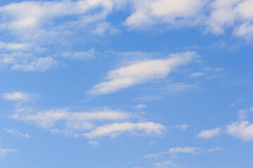 Naklejka premium beautiful white cloudy on blue sky background at noon in Thailand