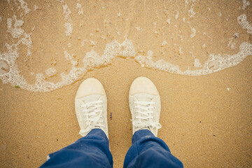 Naklejka premium feet on the beach