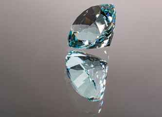 Photo of a Mint Ice Blue colored Obsidian gemstone, cut in the shape of a Spinner, with reflection...