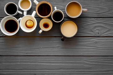 Flay lay with cups - coffee break - on wooden background top view copy space