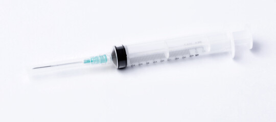 Empty syringe closeup on white background.
