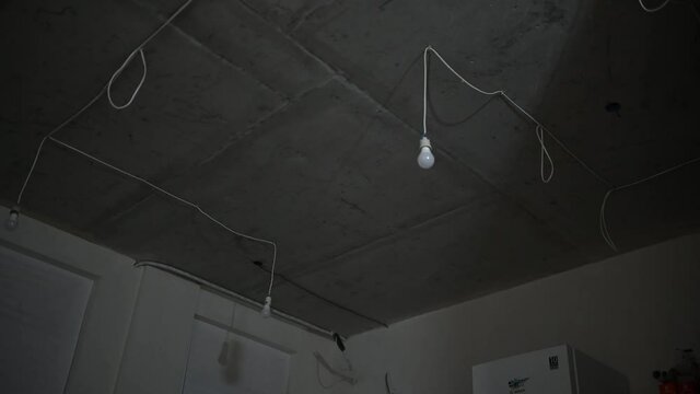 Concrete Ceiling of the apartment. Repair and installation of lighting. Evening