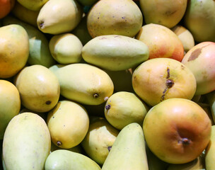 Mango on the counter in the market .