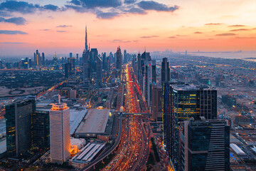 Aerial view of Dubai skyline showing rush hour traffic during sunset