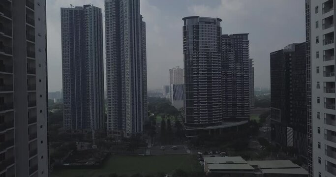 Ungraded, Descending aerial flight through newly developed area. High rise buildings. Drone, 4K. 