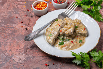 Beef liver in sour cream with parsley.