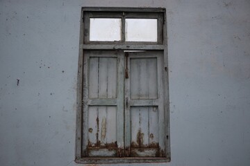 old wooden window with shutters