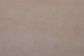 Grungy painted wall with decorative parget white stucco texture background. Structural plaster, rough, uneven surface with textured bumps and marks.