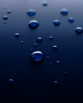 Close up water drops on a blue background