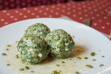 North italian traditional dish: Canederli, boiled dumplings with meat, spinach and cheese
