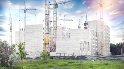 Obraz premium Construction crane and building under construction in the city. Apartments for sale. Housing concept