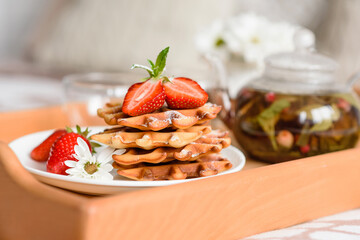 Delicious fresh baked belgian waffles with berries and fruit