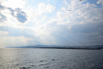 Cloudy seascape with Alexandroupolis harbour entrance
