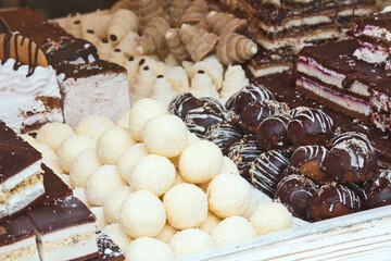 Delicious Balkan confectionary and pastry - rolled pie with poppy seeds, marmalade cakes, sweet pumpkin and cherry pies and thick sweet jelly, fruit kitnikez