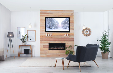 Living room interior with decorative fireplace and modern TV set