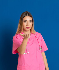 Fototapeta premium Blonde doctor with pink uniform