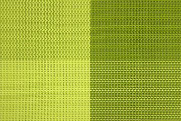 green background, an abstraction of woven threads in different shades