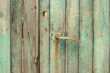 old wooden gate with a heart shaped handle