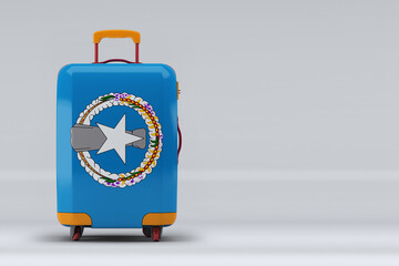 Northern Mariana Islands national flag on a stylish suitcases on color background. Space for text. International travel and tourism concept. 3D rendering.
