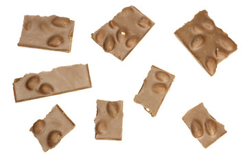 Milk chocolate with nuts broken into pieces isolated on white