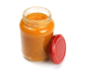 Pumpkin porridge in a glass jar isolated on white, natural, healthy baby food