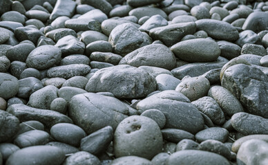 Black pebbles on the beach