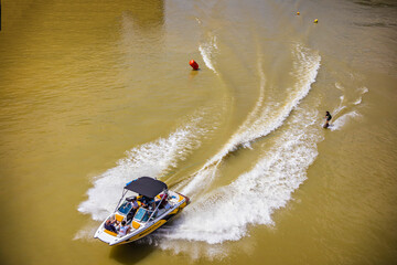Man on water ski after the speed boat on Garonne River in Toulouse, France