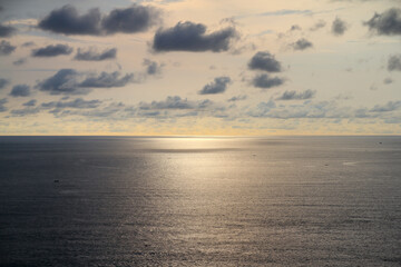 sunset over the ocean with sky and clouds 