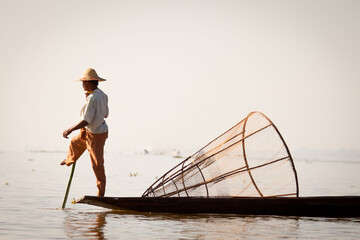 Intha fisherman in the boat on the water, Inle lake, Myanmar (Burma)