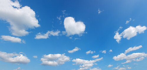 heart shape cloud over blue panoramic sky. love theme background. high resolution