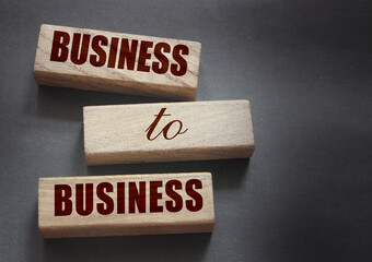 Wooden blocks with words Business to Business. B2B marketing concept