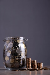 Coins on jar glass. Finance or saving concept