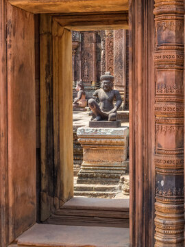 Kneeling Guardians Keep Watch Over The Interior Of The 'Citadel Of The Women' -  Banteay Srei, Cambodia