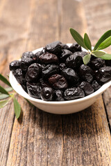 bowl of black olive and leaf