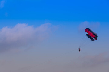 Paraglider flying over the sky