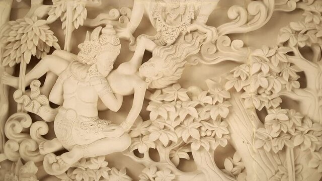 Traditional balinese carving of two figures, close up