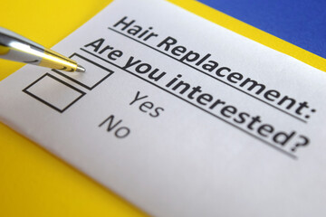 Fototapeta premium One person is answering question about hair replacement.