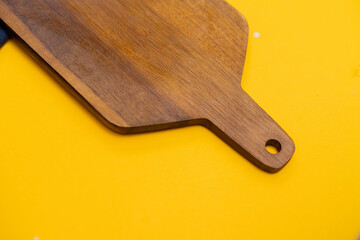 wooden board on a yellow background
