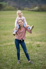Fototapeta premium Two little sisters girls on spring portrait.