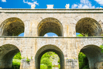 Croatia, beautiful 19 century stone bridge with arches in Tounj on Tounjcica river