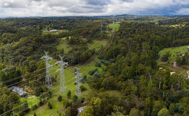 Aerial view of power pylons receding into the distance in the Melbourne Australia suburb of Donvale