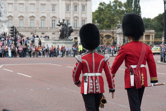 The Queen's Guards In The Red Uniforms. Ceremony Of The Changing Of The Guard At Buckingham Palace In London.