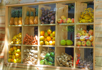 fruits and vegetables in wooden shelving