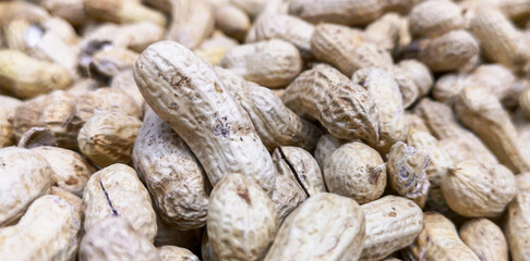 Unpeeled peanuts as background