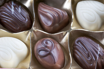 Assorted sweets of white and dark milk chocolate