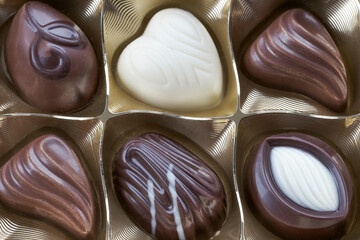 Assorted sweets of white and dark milk chocolate