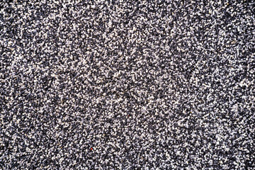 Close up surface of texture of small stone or sand wall background