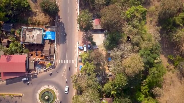 A drone shot flying above a roundabout near Siolim bridge, India.