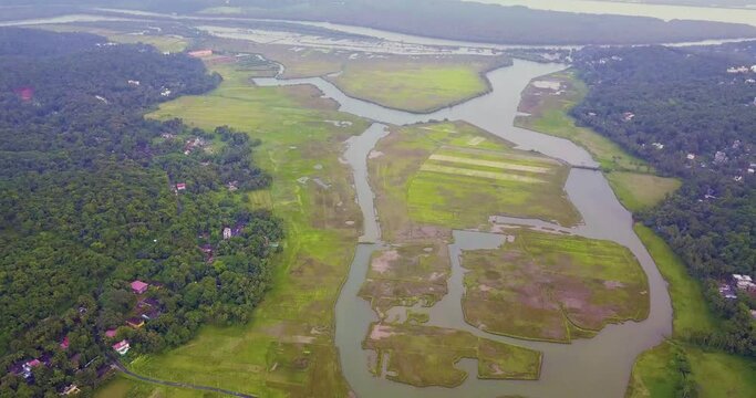A drone shot flying over the field in Goa, India.