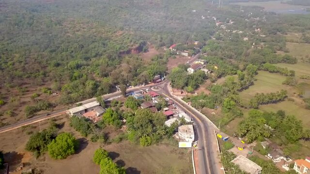 A drone shot flying over the streets in Goa, India